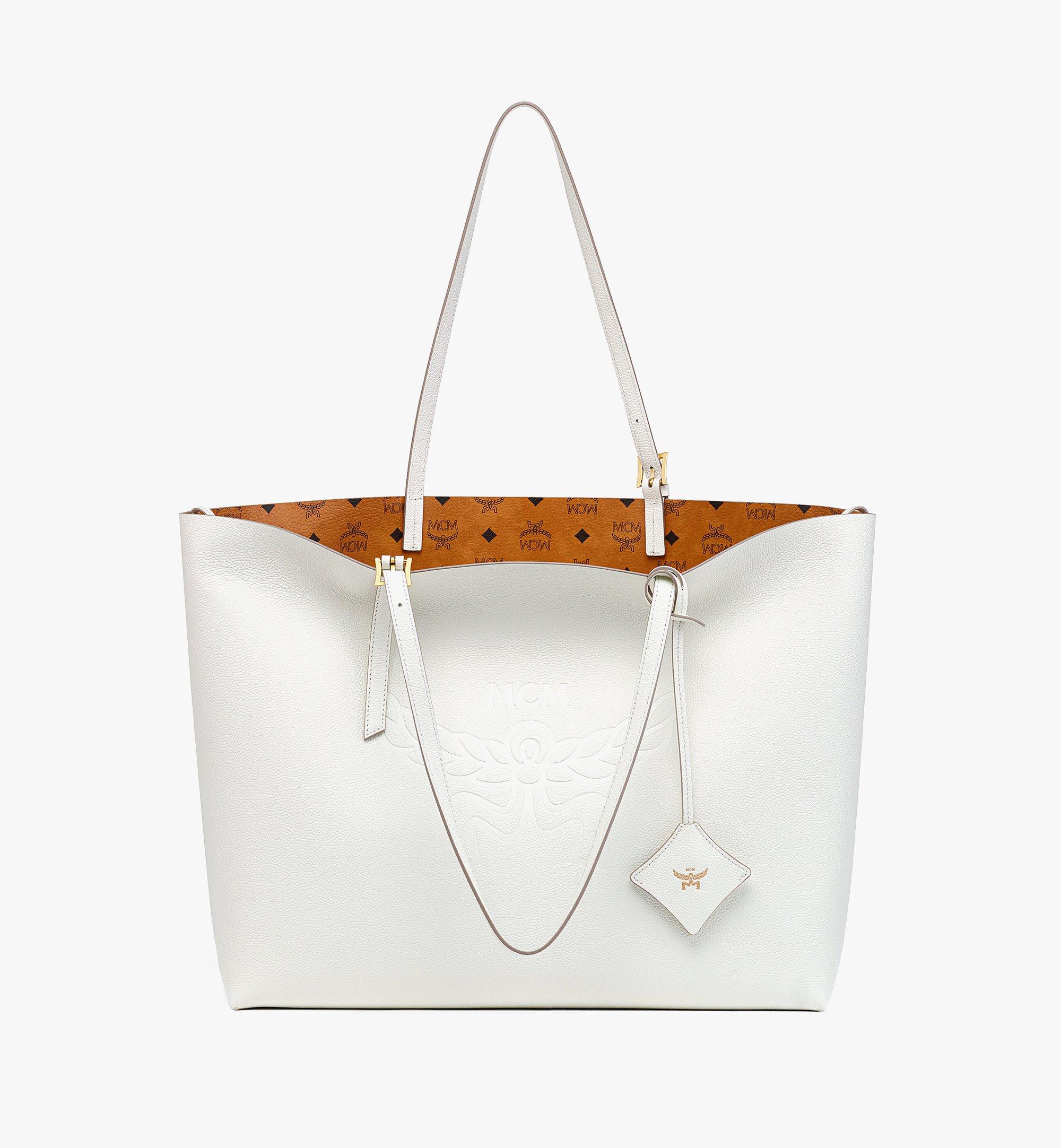 Mcm bag white and on sale black